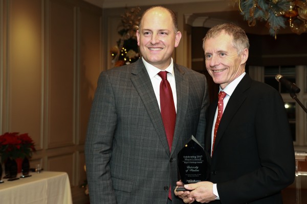 UWindsor President Alan Wildeman accepts the Heritage Award from Windsor Mayor Drew Dilkens during the Celebrating 2017 Mayor&#039;s Award on Tuesday, Dec. 19, 2017.