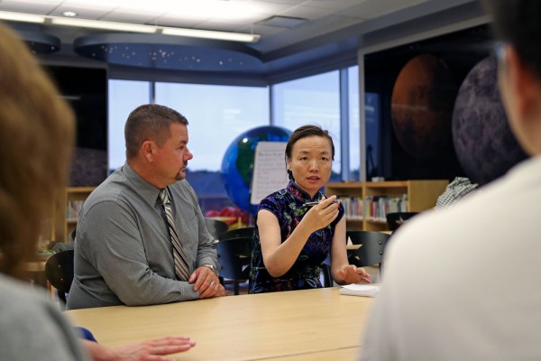 Talbot Trail Public School Principal Chris Mills and University of Windsor&#039;s Shijing Xu participate in a Skype call with Ren He Jei Primary School in Chongqing, China.