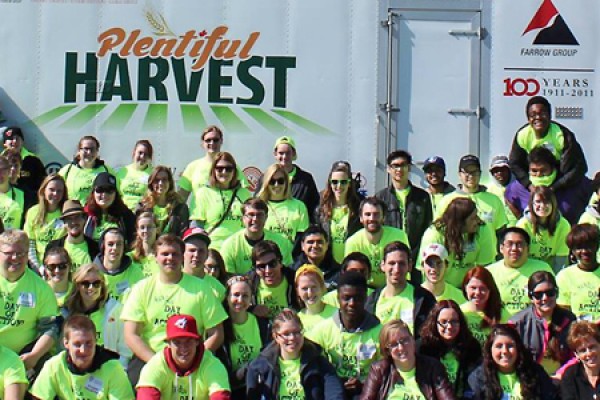 people posed in front of truck