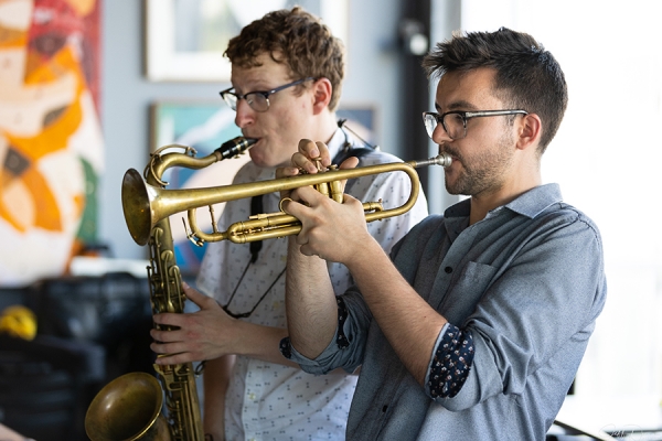 Ryan Bills playing saxophone and Austin Di Pietro on trumpet