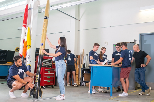 students building entry in the Intercollegiate Rocket Engineering Competition