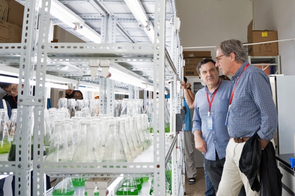 Mike McKay and George Bullerjahn tour a lab