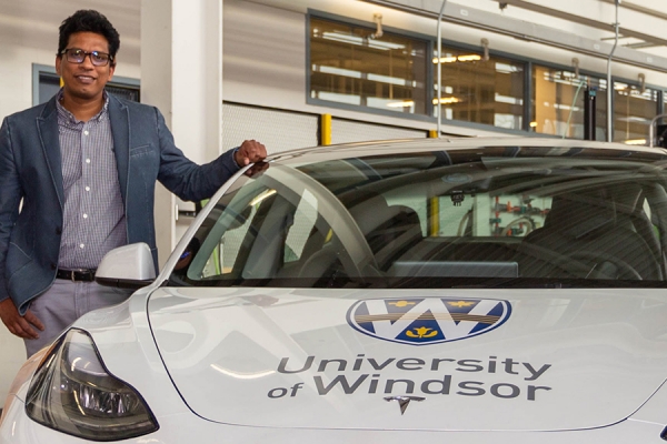 Bala Balasingham in electric vehicle laboratory