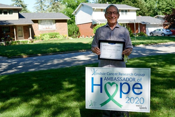 Hakam Abu-Zahra with lawn sign