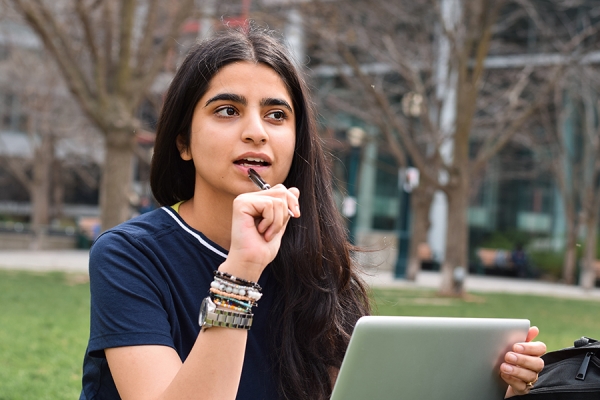 young person looking like she&#039;s thoughtfully considering her options