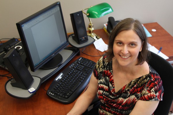 Sara Elliott at her desk