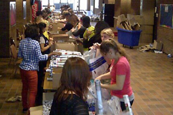 Members of the Residence Life Staff and Windsor Inter Residence Council stuff welcome packages during training in Vanier Hall.