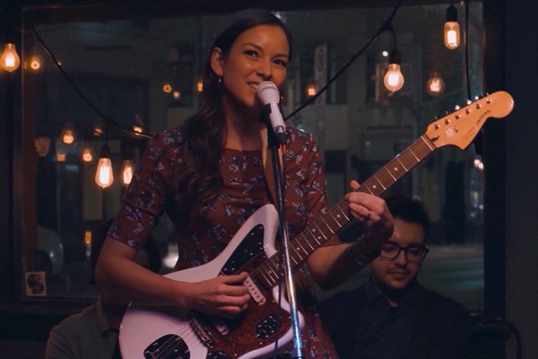 Crissi Cochrane playing guitar