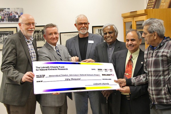 Jeff Berryman, Douglas Kneale, Phil Dutton, Datta Pillay, and Siyaram Pandey accept a gift from donor Loknath Chawla