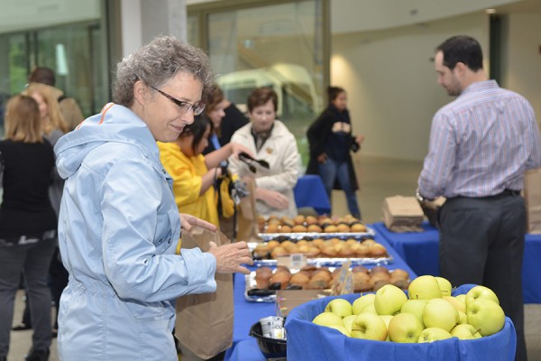 people eyeing breakfast buffet