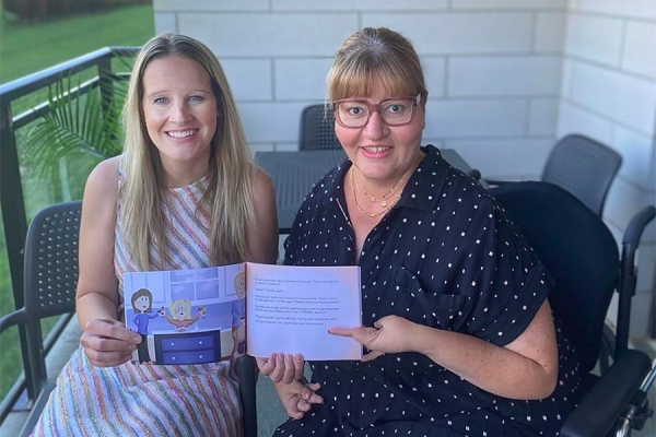 UWindsor alumnae Anne-Marie DePape and Christine Quaglia hold children&#039;s book.