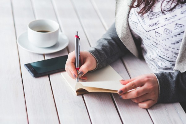 hands writing note