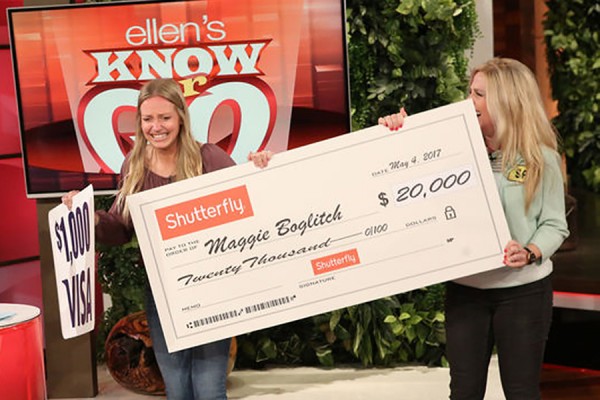 Maggie Boglitch and her mother Sam Boglitch hold a $20,000 cheque