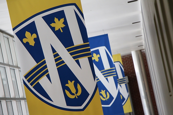 hanging banners bearing UWindsor logo shield