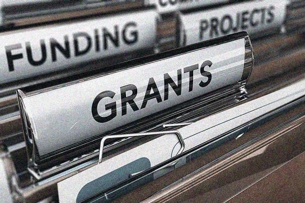 file folders marked &quot;funding,&quot; &quot;grants&quot;