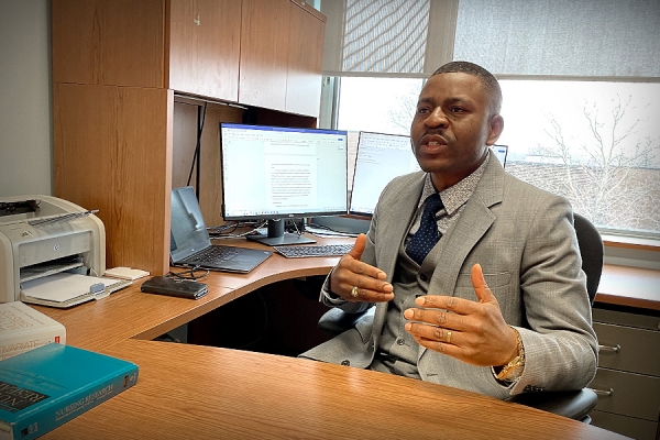 Eric Tanlaka at desk