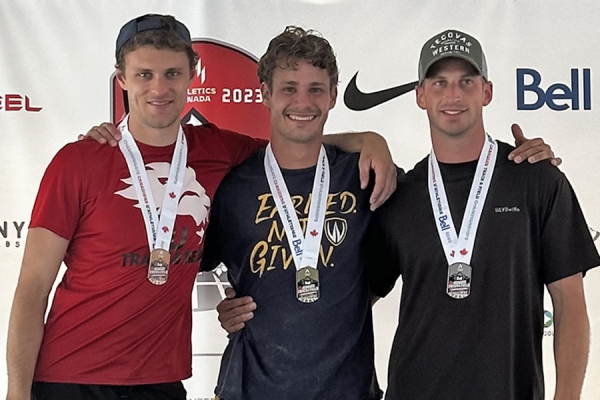 three pole vaulters wearing medals