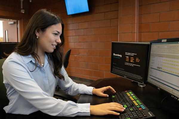 student working at data analytics workstation