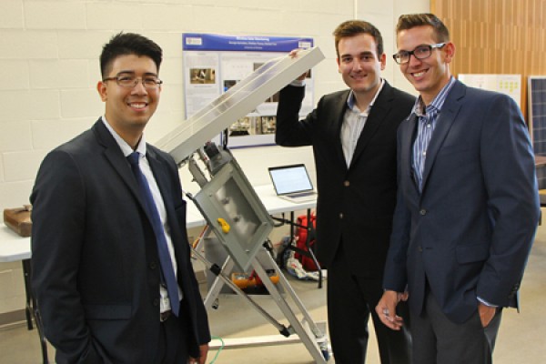 Shahab Tran, George Kyrtsakas and Sheldon Tracey pose with solar panel array.