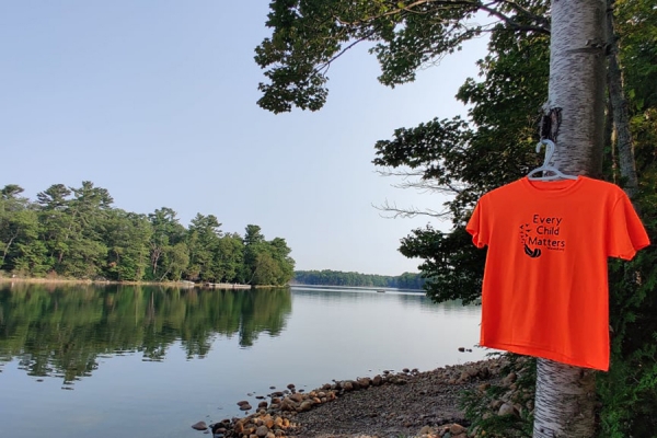 Orange shirt hanging by shores of Georgian Bay