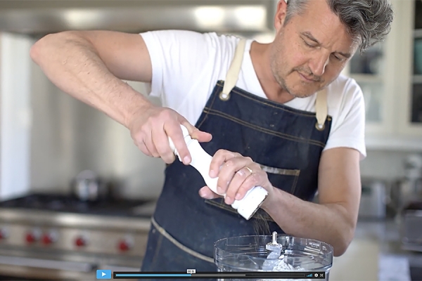 History professor Rob Nelson demonstrates preparation of a dish.