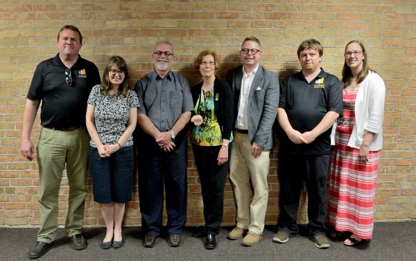 History professor Miriam Wright (second left) congratulated the Gathering Our Heroes project team for receiving the History Department Community Heritage Medal.Photo Credit: Les McCracken. 