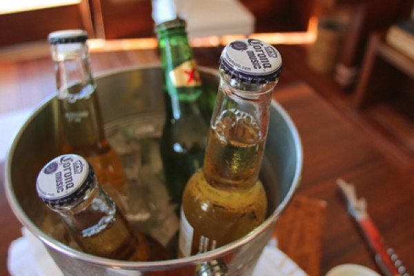 Dos Equis and Coronoa bottles in ice.