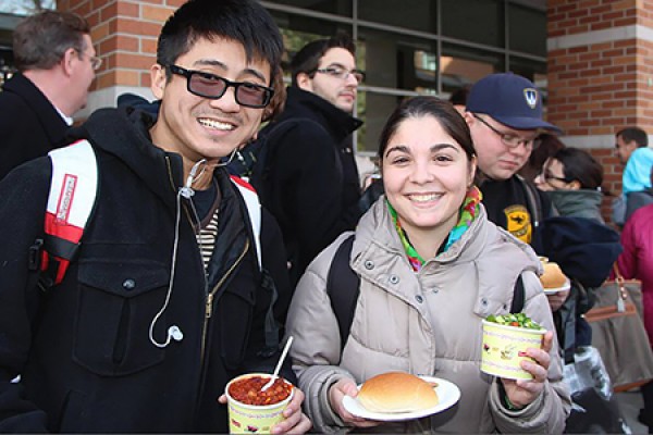 Students eating warming bowls of chili during the 2013 Fall Fest.