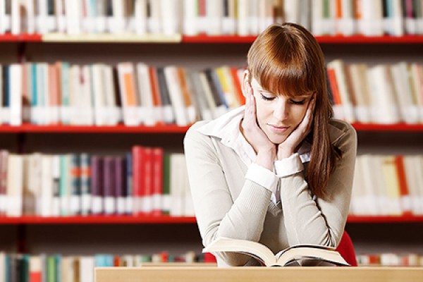 student reading in library