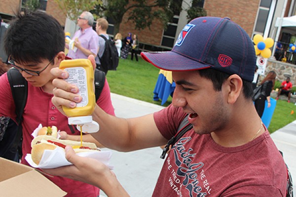 Jeff Olivera pouring mustard