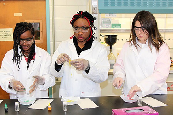 Young women create coloured slime