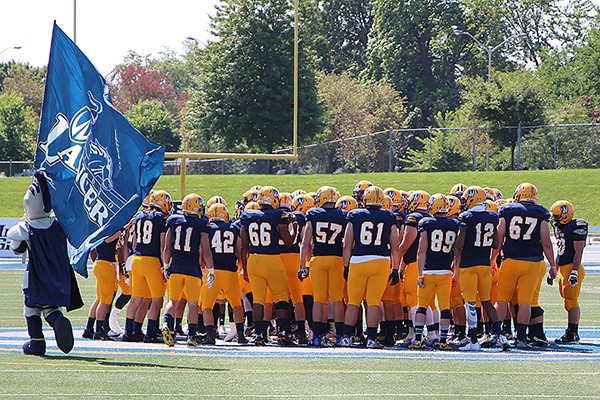 Lancer football players rallied by mascot Winston