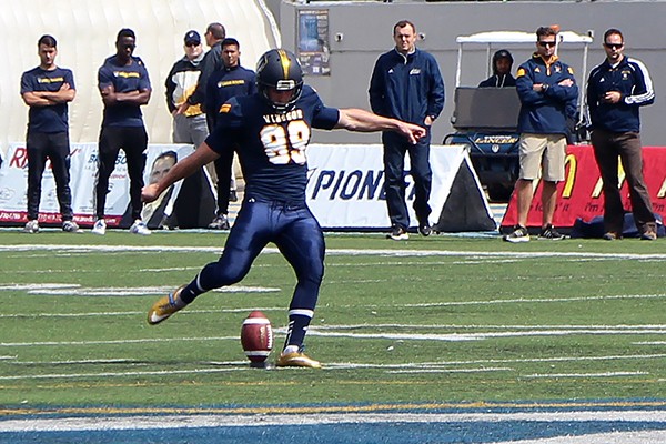 Kicker headed toward ball on stand