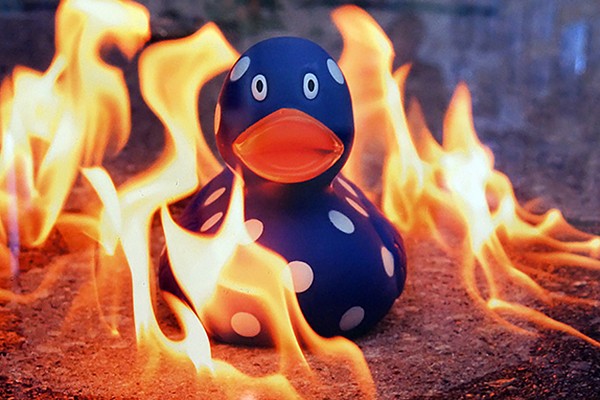 rubber duckie surrounded by flames