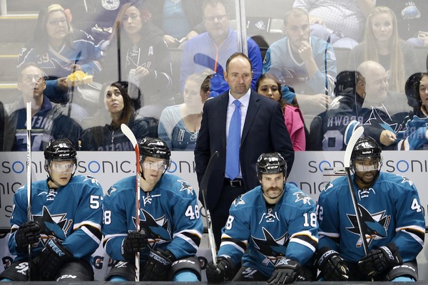 Coach Pete DeBoer behind bench of San Jose Sharks