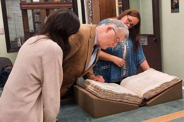 archivists poring over records