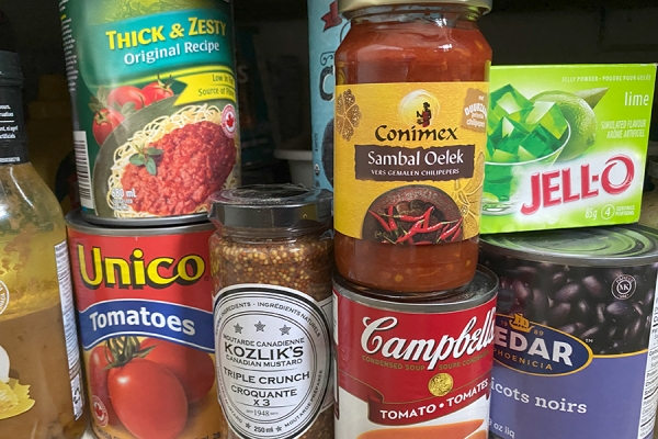 shelf of assorted canned goods