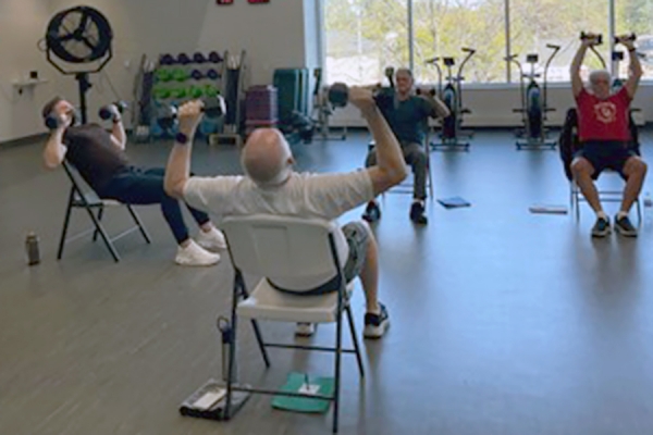 participants in cardiac rehab lifting weights