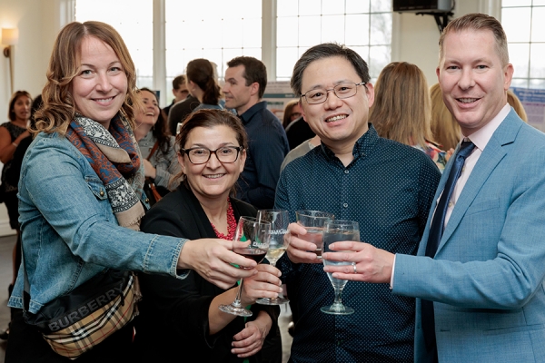 people clinking wine goblets