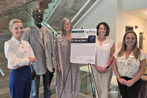 Dorota Lubanska and Alioune Ngom with ChildCan officials Suzanne Elliott, Sarah Dimitropoulos, and Lorraine Jewell.