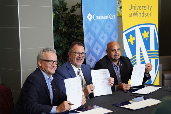 officials signing documents