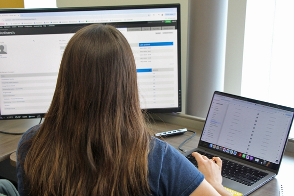 woman working on Drupal at computer