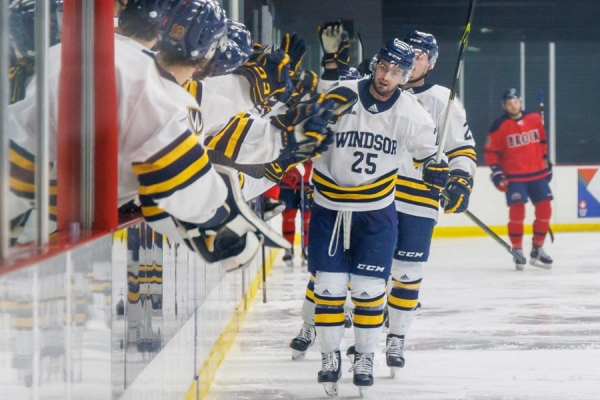 hockey players exchanging high-fives