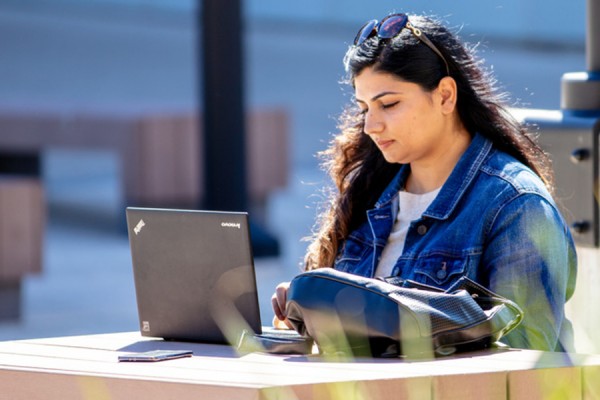 student consulting computer