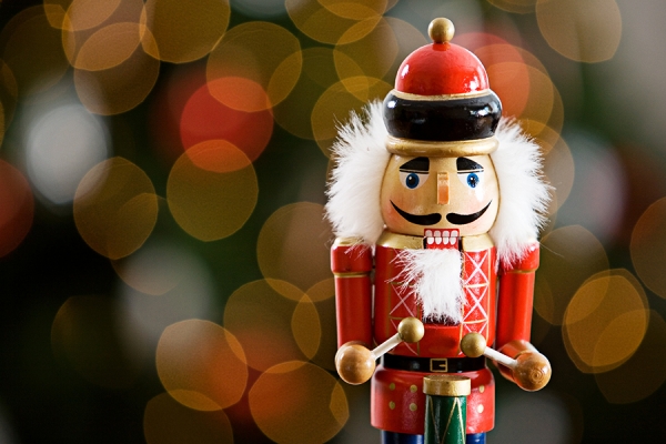 nutcracker in front of Christmas tree