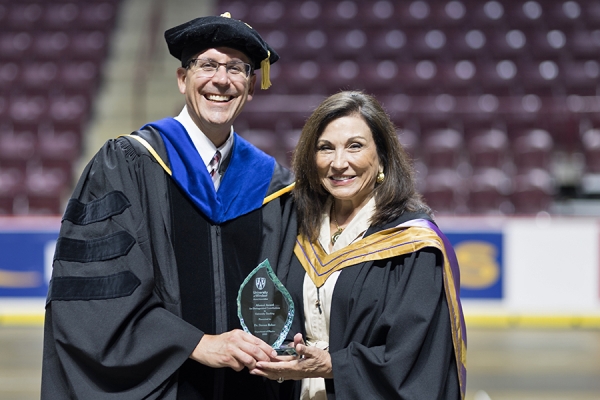 Steven Rehse accepts congratulations from Geri Salinitri