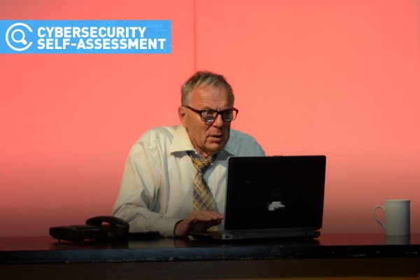 man looking frazzled with computer