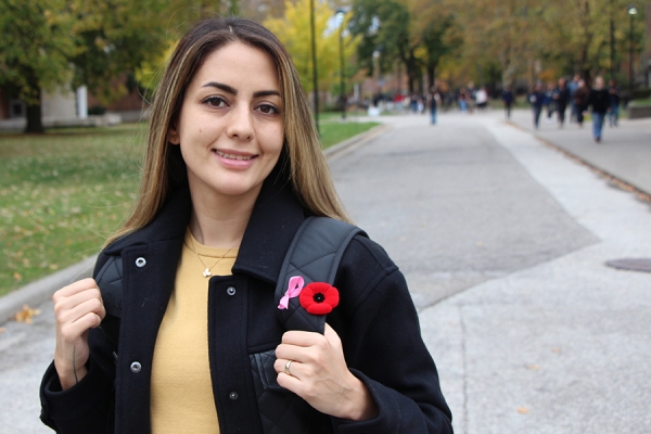 Shahrzad Mousavi showing poppy on lapel