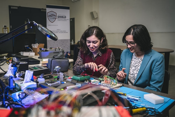 Shiva Nejati and Kunj Dhonde working on circuitry