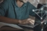 student sitting at laptop computer